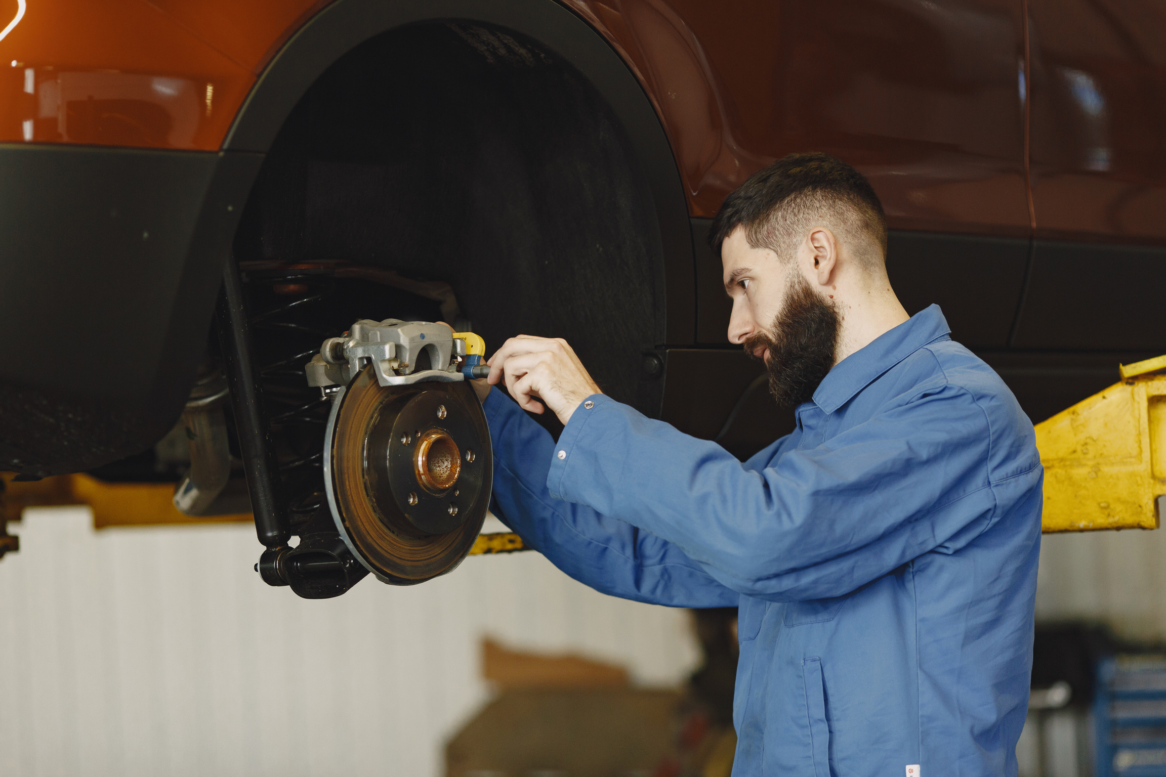 Mechanic Checking Car Brake Disc